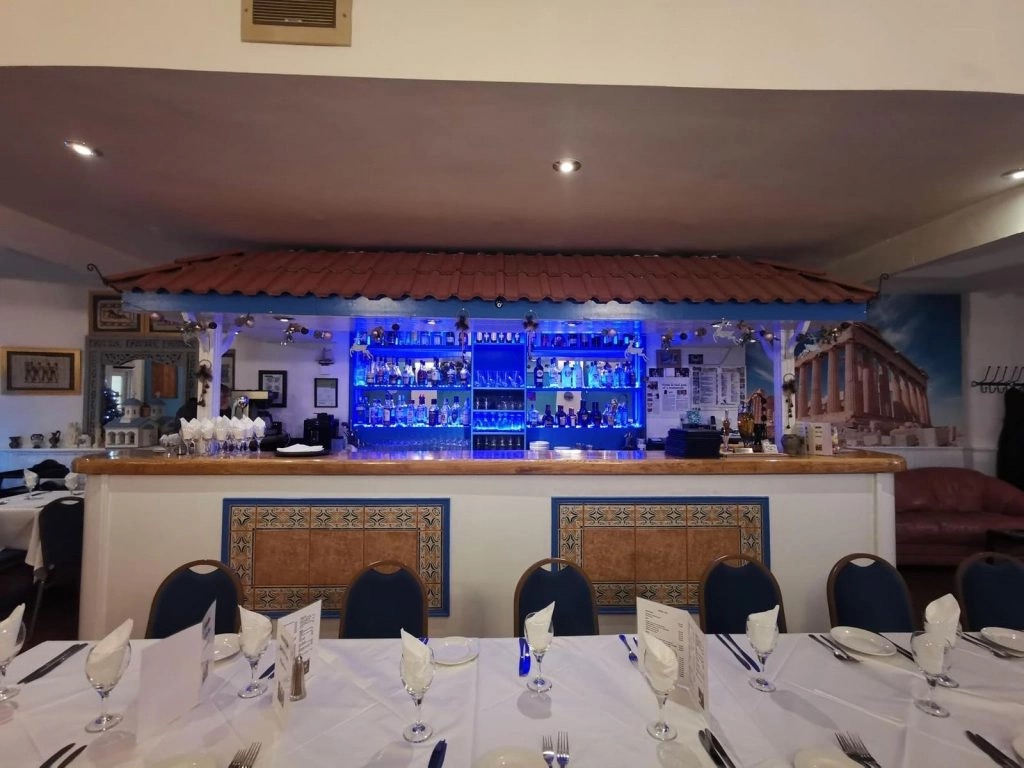 The blue-lit bar and terracotta tiled canopy