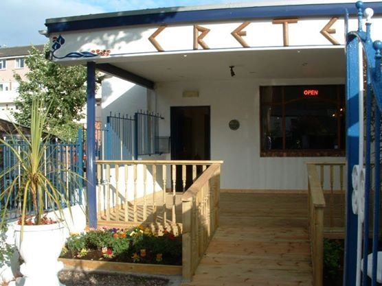 The taverna exterior with ramp and garden entrance