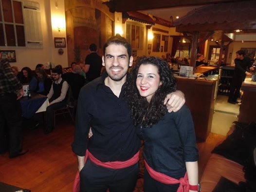 Two members of the taverna team in the dining room