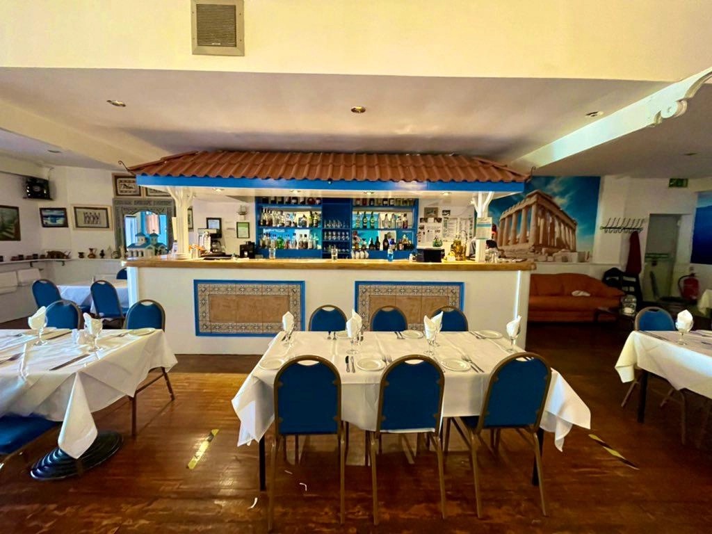 The taverna bar and tables set for dinner